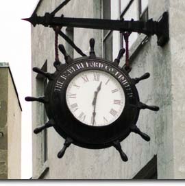A clock in the shape of a ship’s wheel